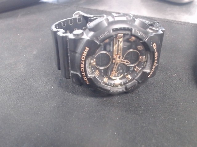 Gold and black watch g shock