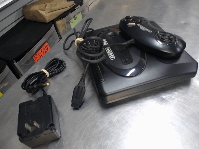 Sega genesis+man+chargeur (no cable tv)