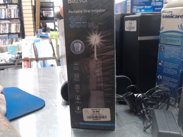 Portable oral irrigator