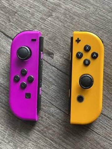 Joy-con de switch mauve et jaune