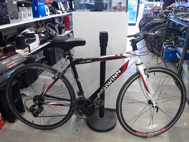 Red white and black bike with ccm seat