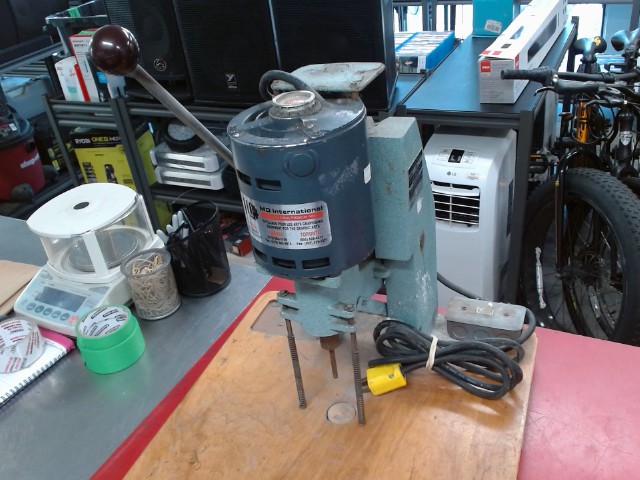 Paper drilling machine