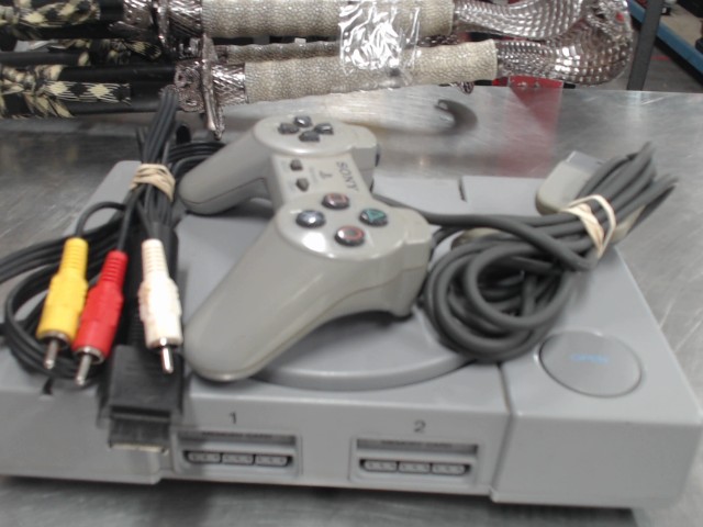 Console playstation 1+man+fils
