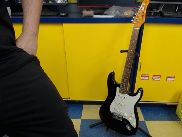 Black strat style jay turser guitar