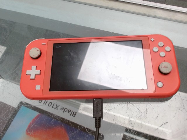 Nintendo switch lite rose avec chargeur