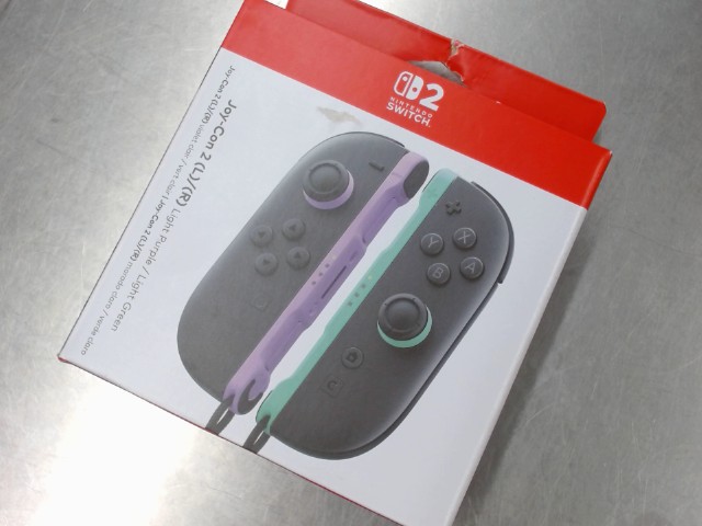 Joycon 2 dans la boute mauve et vert