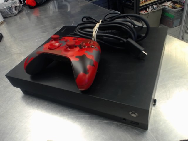 Console xbox x + man rouge + fils