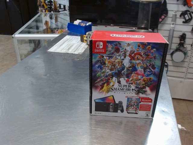 Switch oled dans boite + acc