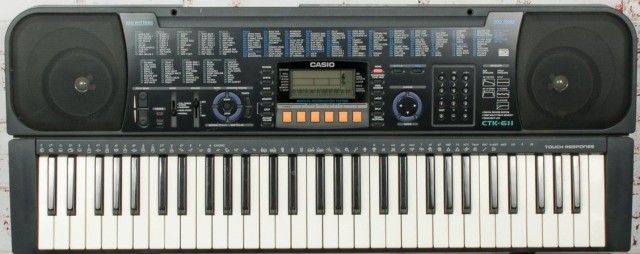 Keyboar casio gris av fils