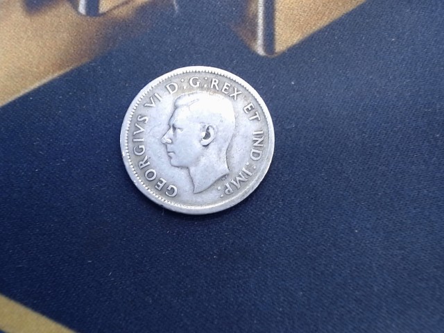 Coin 25 cenne en argent + boucle doreill