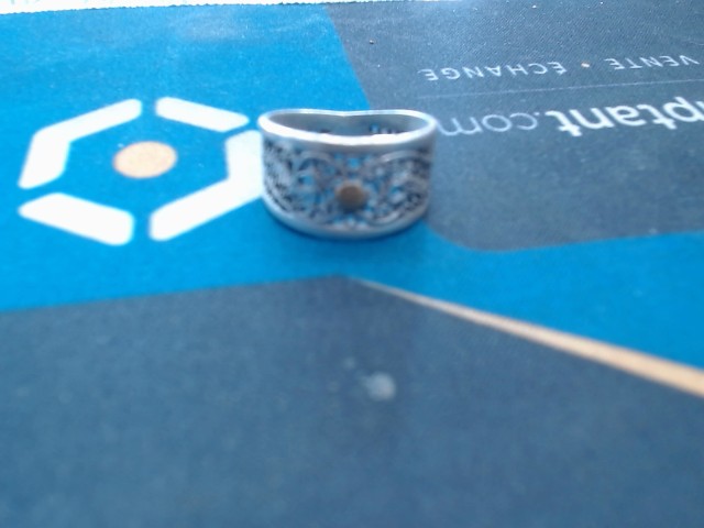 Bague en argent avec ptit poin or