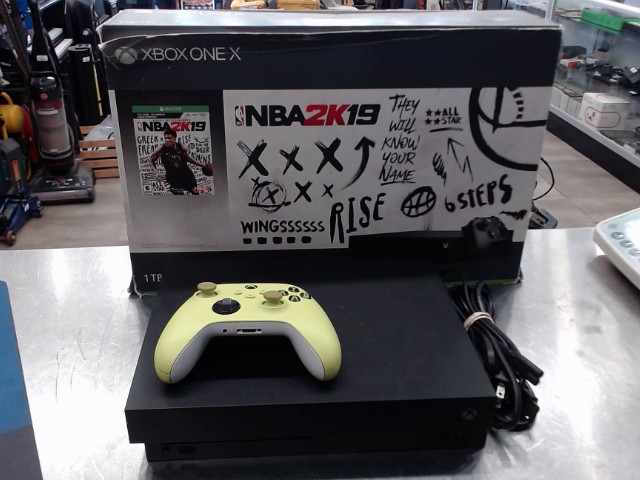 Console xbox one x+cables et boite