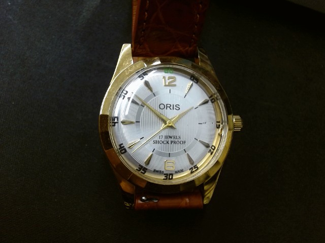 Montre vintage cuir et face gold