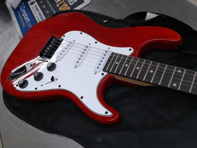 Guitare dans case soft