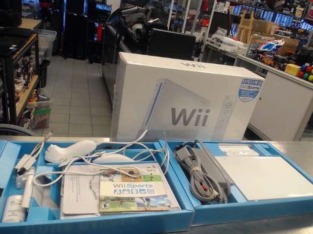 Wii avec manettes + fils dans la boite