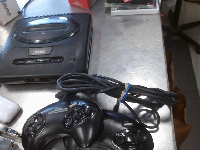 Sega genesis avec 2 man + 1 jeux