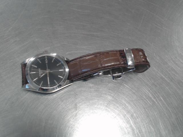 Montre tissot fond en or bracelet brun