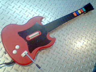 Guitar hero guitar ps2 a fil rouge