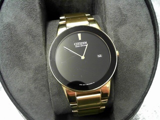 Black dial gold eco drive watch