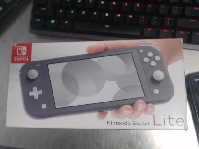 Switch lite jaune avec doc