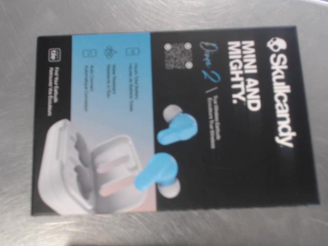 Skullcandy ear buds in dock